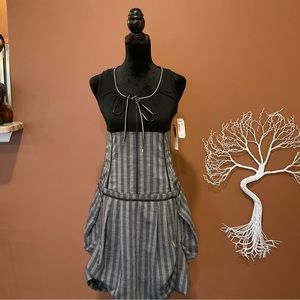 Adorable, asymmetrical Baï Amour smock dress with zipper and string detailing.